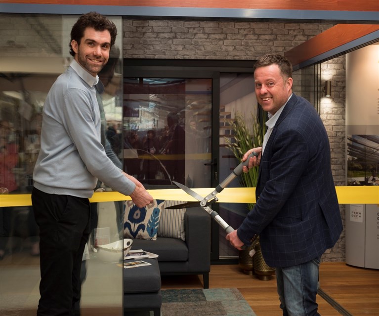 Justin Williams of Fron Goch Garden Centre and Ken Grayson officially open the Garden Room