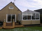 Glass roofed conservatory with 'Liv-in' room feature