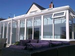 Glass roofed conservatory with 'Liv-in' room feature