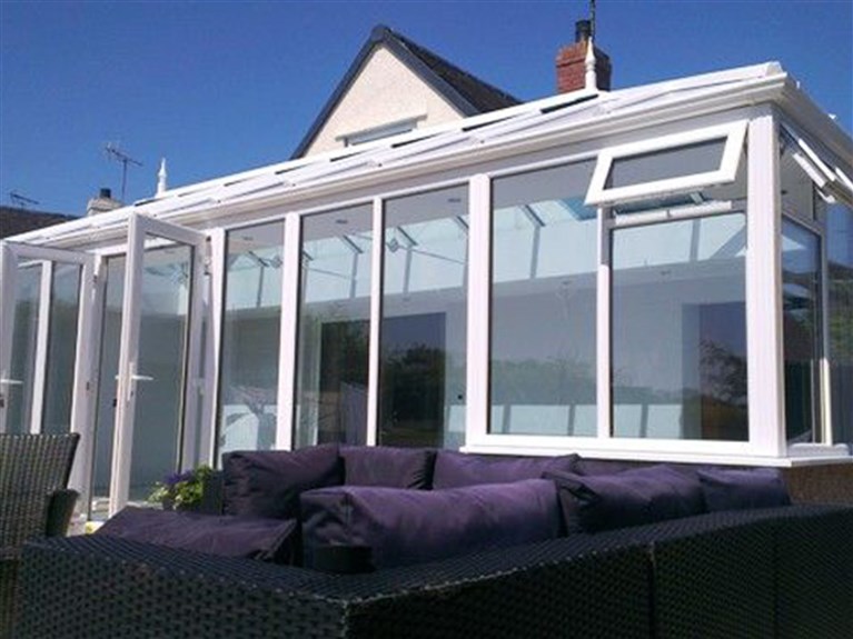Glass roofed conservatory with 'Liv-in' room feature